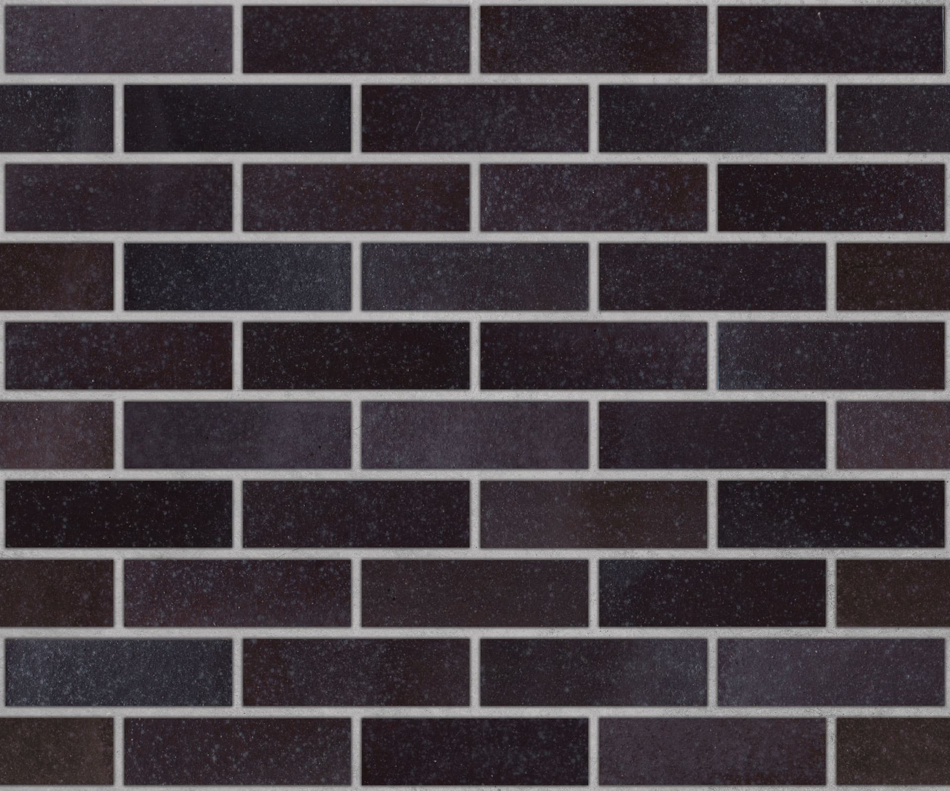 Dark Ironspot colored brick, in the colorGroup Black Brick, Plum Brick. The product is clay brick.